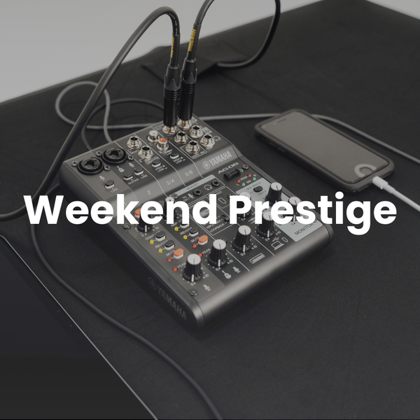Audio mixer with smartphone on a dark surface, labeled 'Weekend Prestige'.